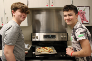  students cooking together